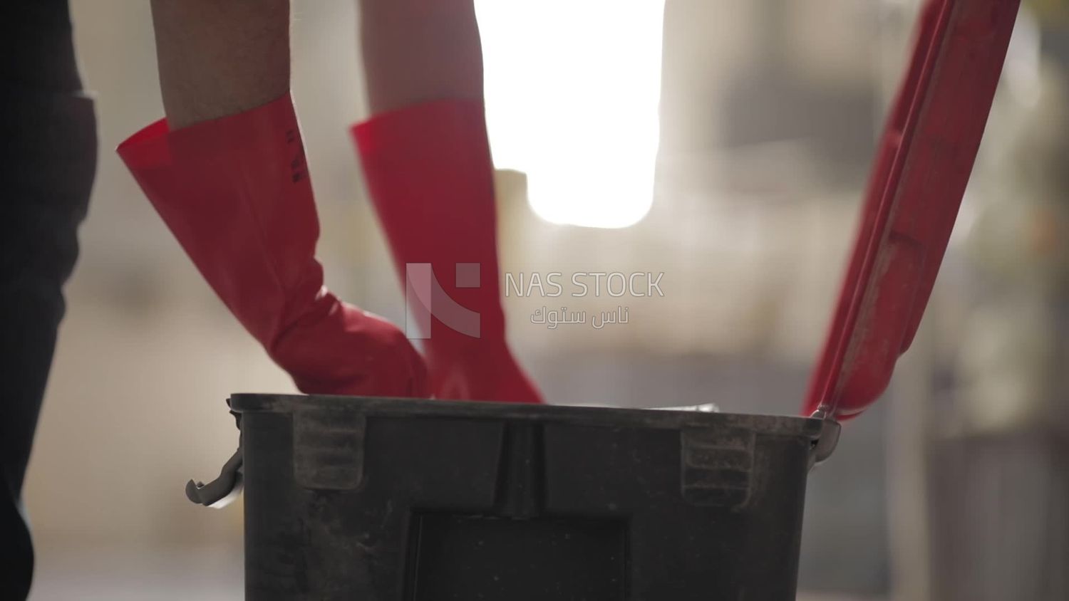 Worker puts paper into a box at a factory, factory equipment