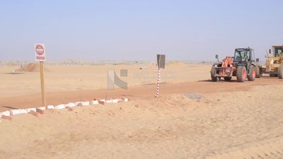 Man driving an excavator in solar energy