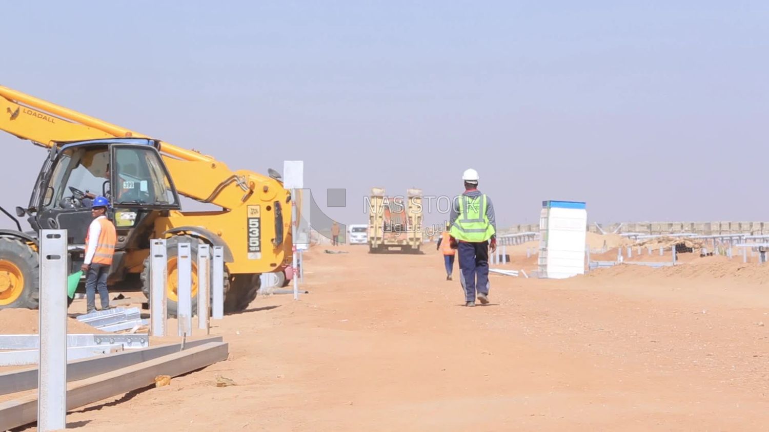 Man driving an excavator in solar energy