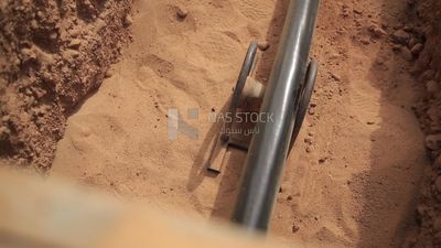 Workers burying electric cables