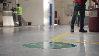 Worker pulls a bag at a factory, factory equipment