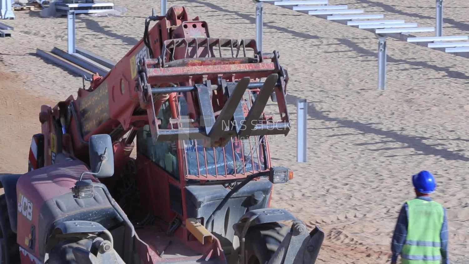 Man driving an excavator in solar energy