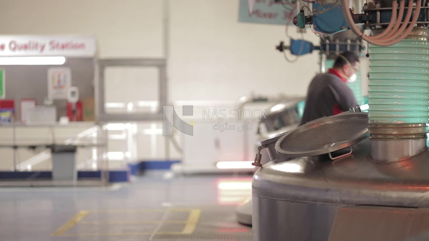 Man opens the door of a machine in a factory, factory equipment