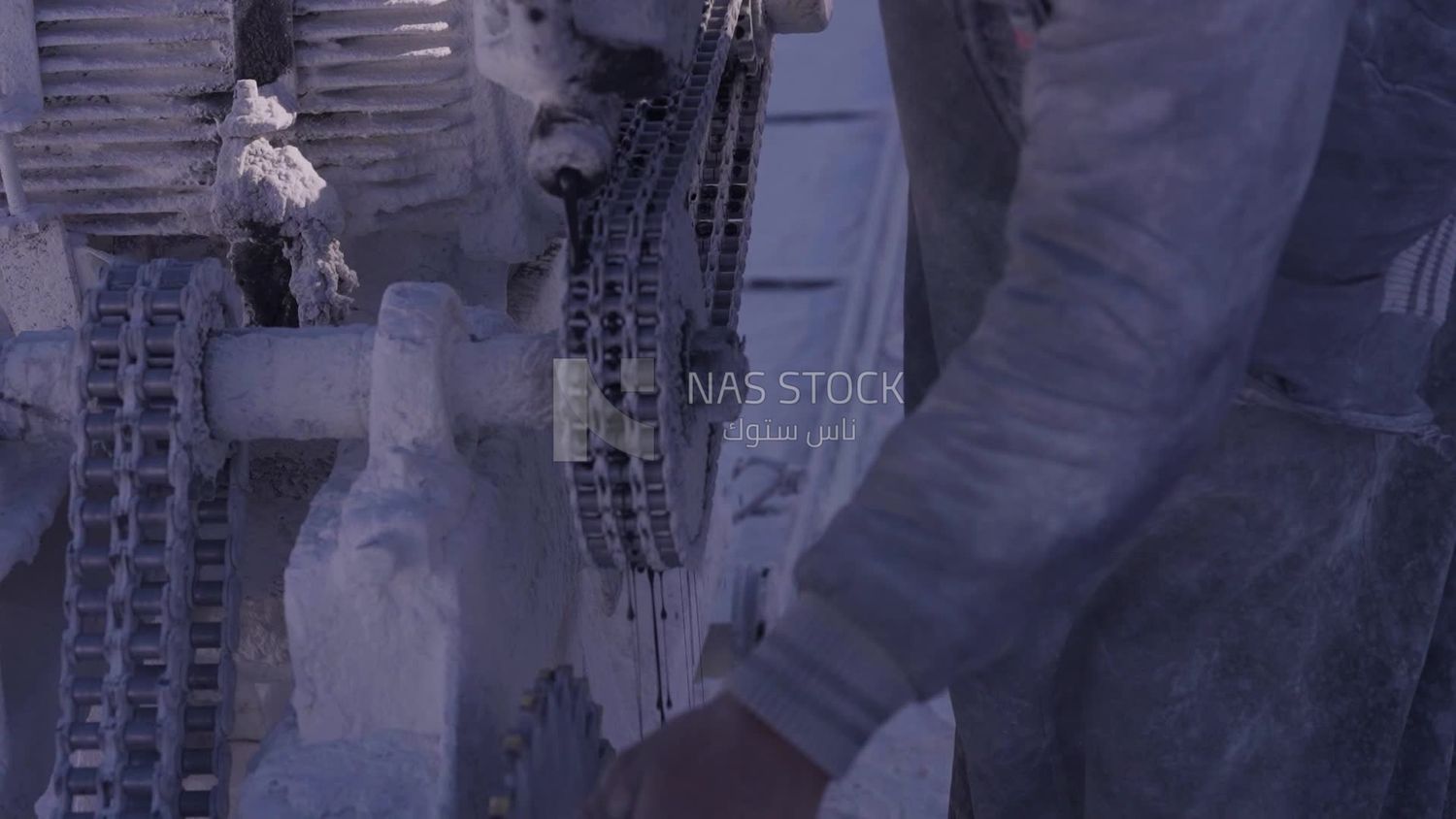 Worker puts black oil in the machine at the quarry, professions and crafts