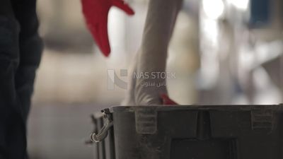Man opens a box in a factory, factory equipment