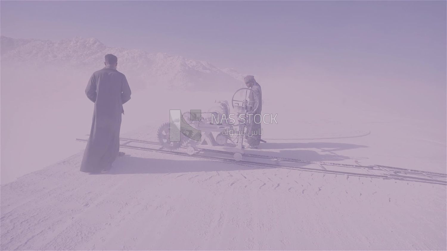 Two men checking the machine in a quarry