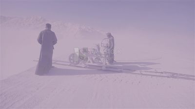 Two men checking the machine in a quarry