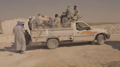 Workers riding a car after finishing the work in the quarry