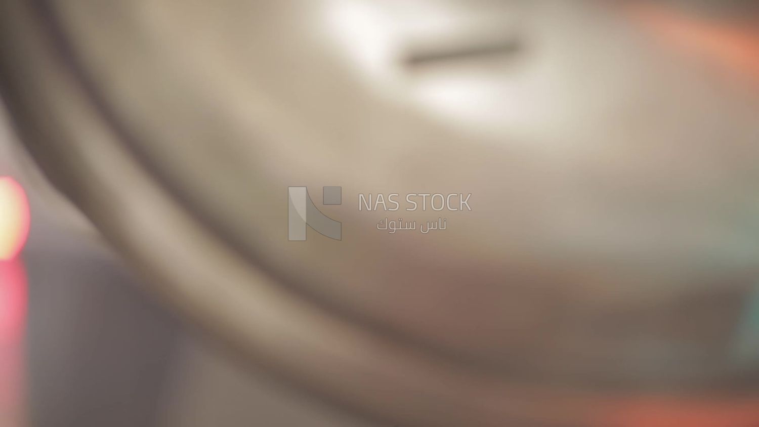 Man opens the door of a machine in a factory, factory equipment
