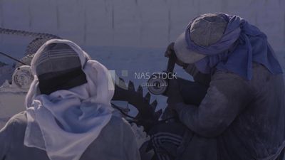 Two men try to fix the machine in the quarry, professions and crafts