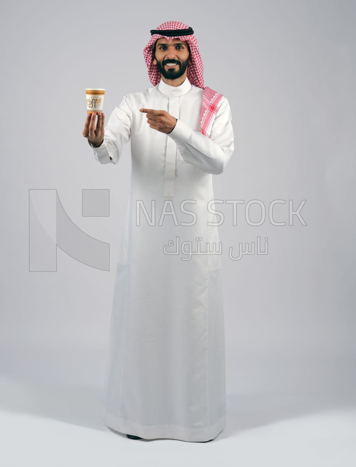 Gulf man holding a cup of coffee