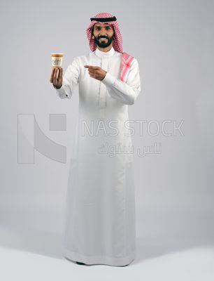 Gulf man holding a cup of coffee