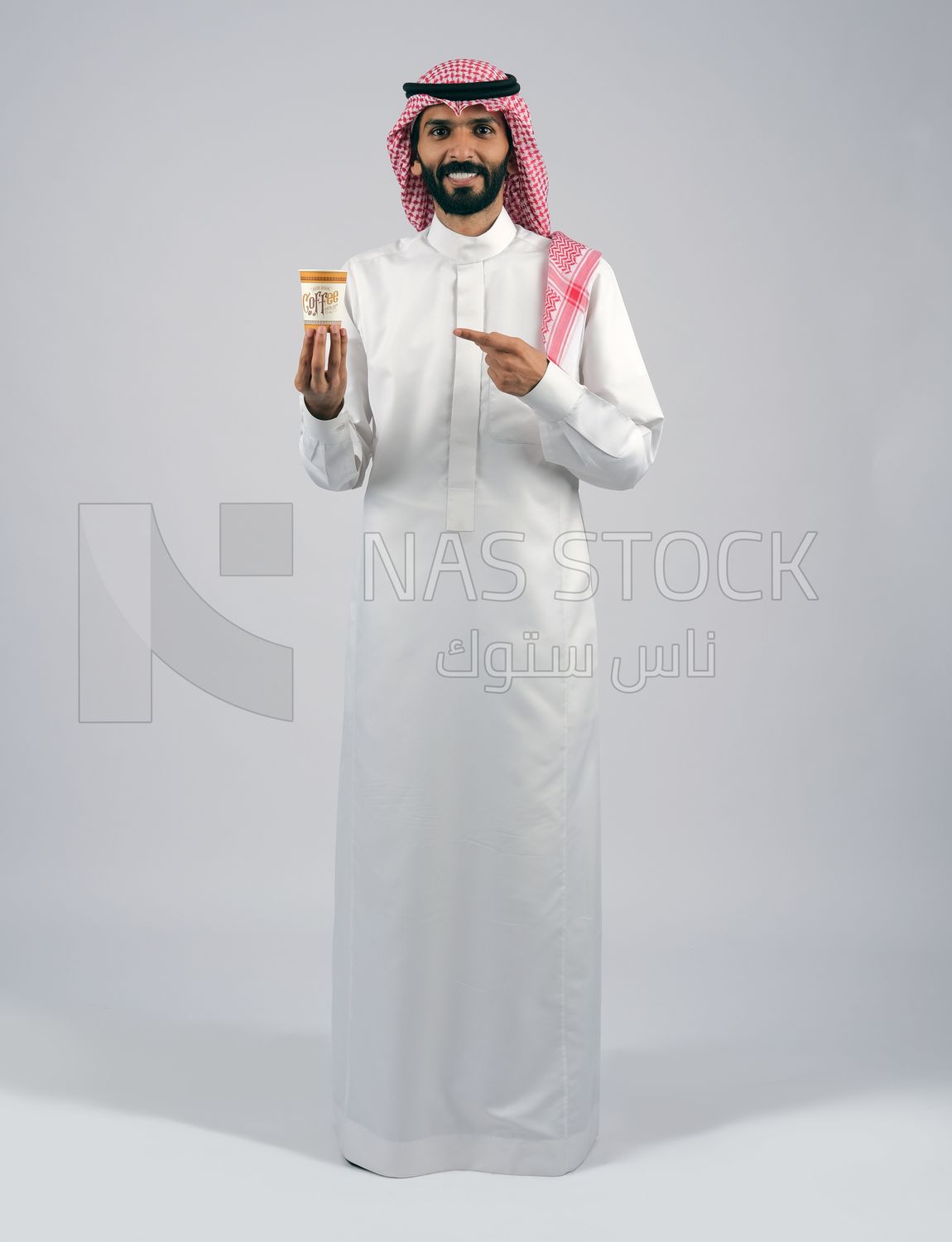 Gulf man holding a cup of coffee