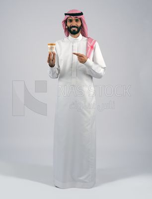 Gulf man holding a cup of coffee