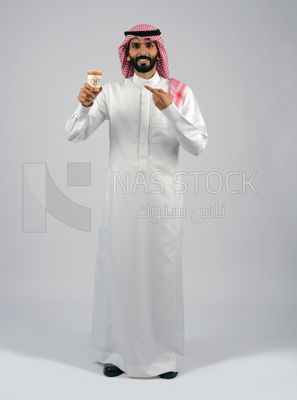 Gulf man holding a cup of coffee