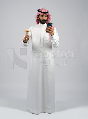 Gulf man holding a cup of coffee and mobile