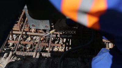 Welder in special clothes goggles safety helmets, steel welding, industrial worker