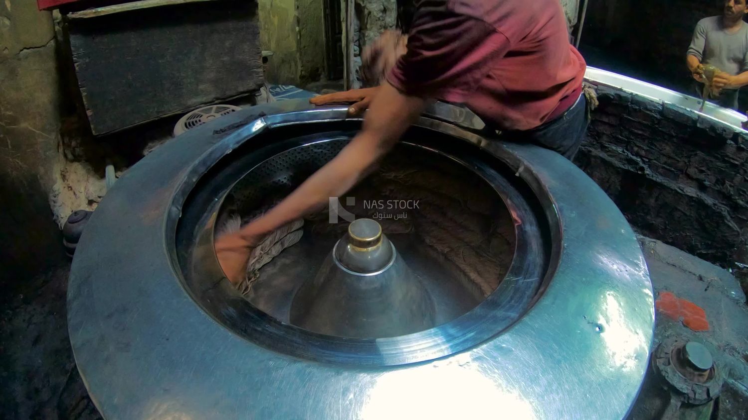Men in a thread dyeing workshop
