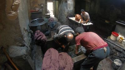 Men in a thread dyeing workshop