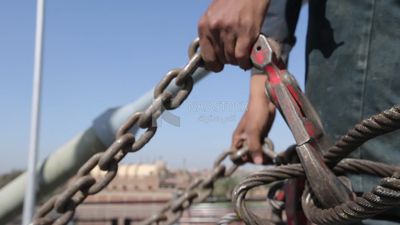 Worker trying to put the steel on a steel wire rope, work, construction, engineering tools and equipment