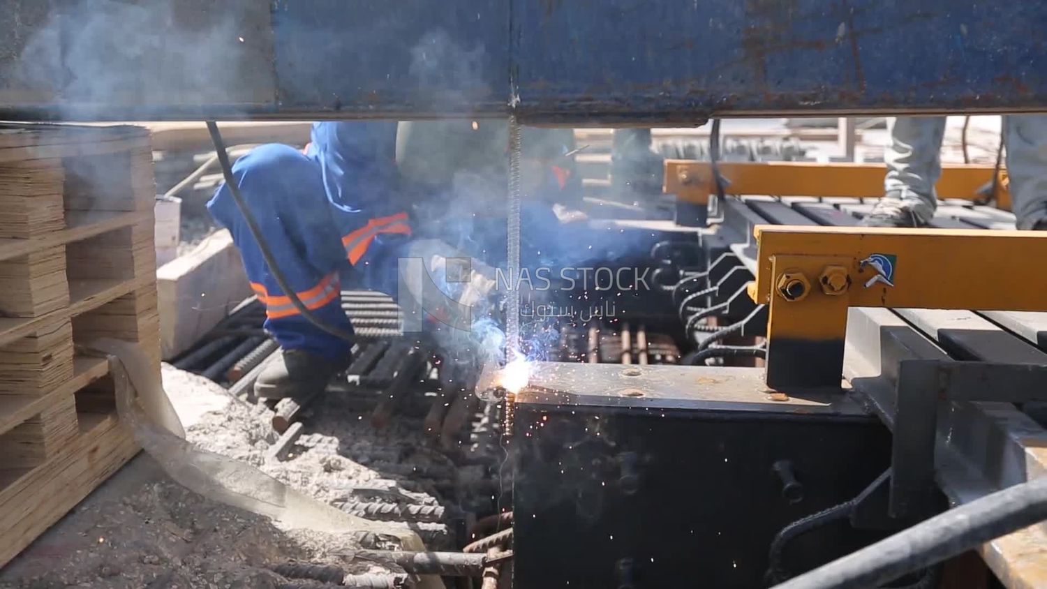 Welder in special clothes goggles safety helmets, steel welding, industrial worker