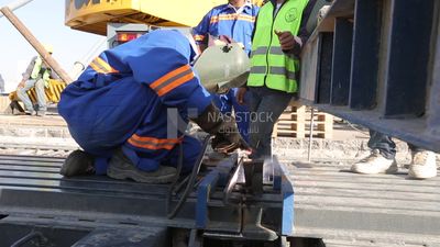 Welder in special clothes goggles safety helmets, steel welding, industrial worker