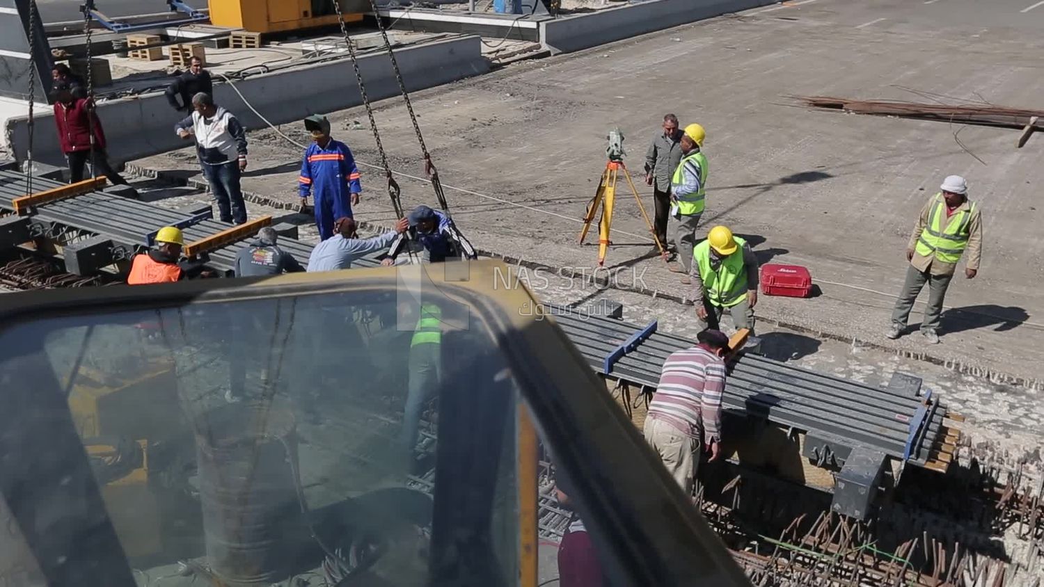 Group of engineers trying to put a part of a bridge to complete it, work, construction, engineering tools and equipment