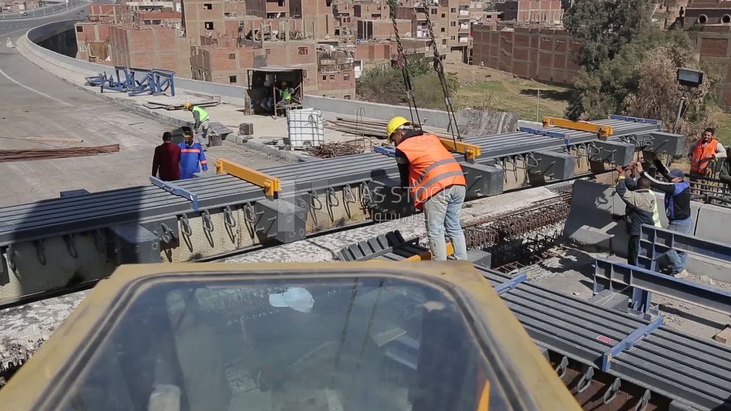Group of engineers trying to put a part of a bridge to complete it, work, construction, engineering tools and equipment