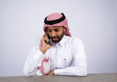 Gulf man talking on the phone