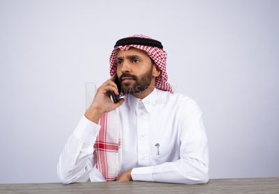 Gulf man talking on the phone