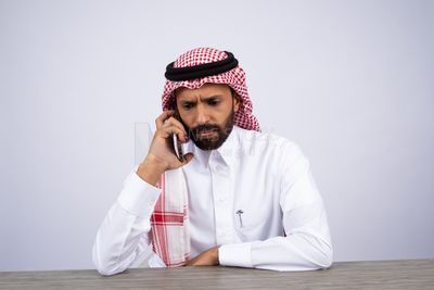 Gulf man talking on the phone