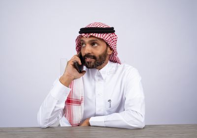 Gulf man talking on the phone