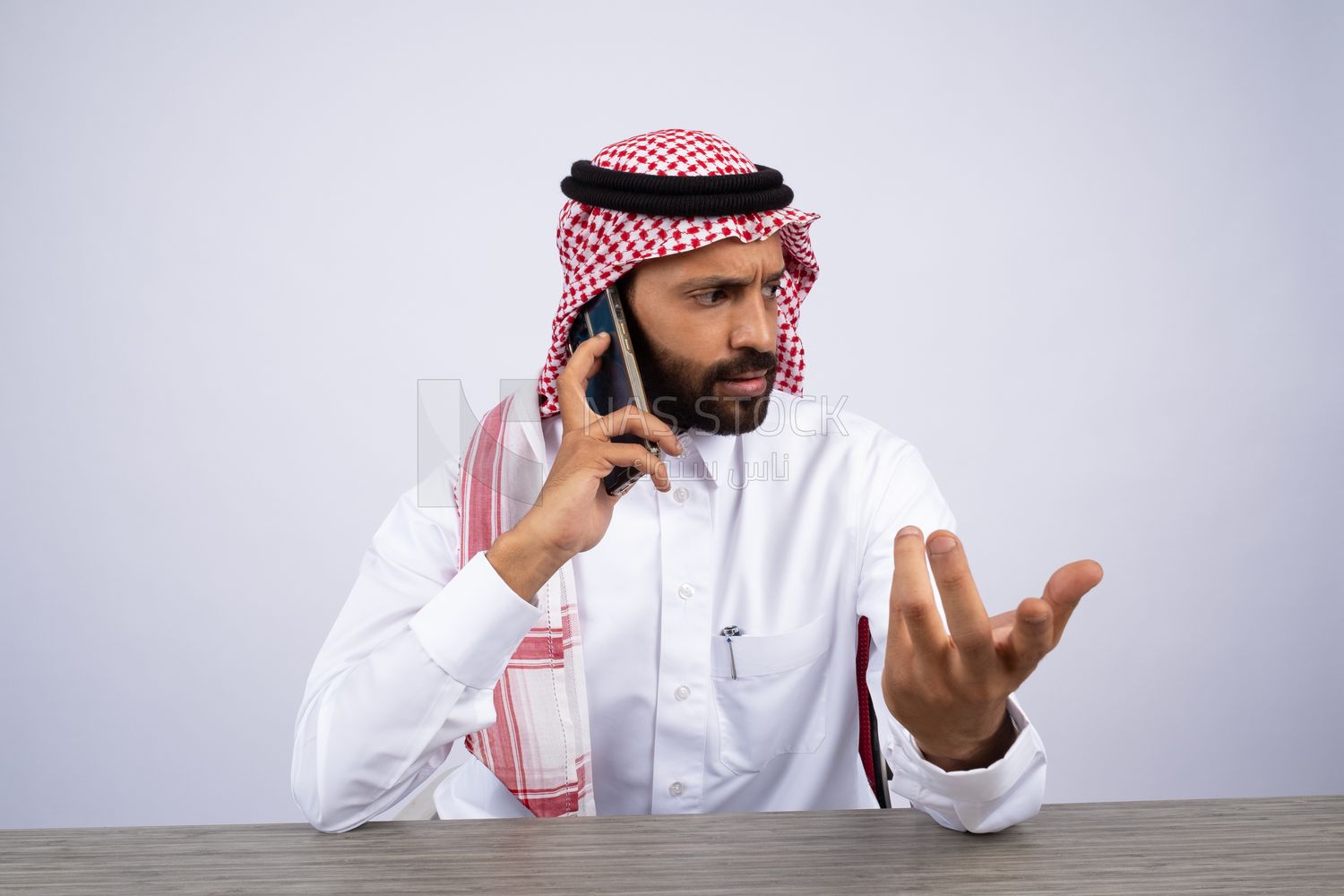 Gulf man talking on the phone