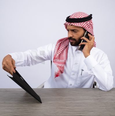 Gulf man making a call and using a tablet
