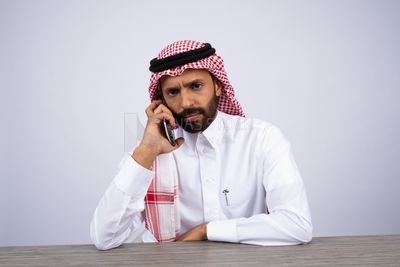 Gulf man talking on the phone