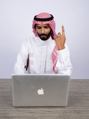 Gulf man using laptop