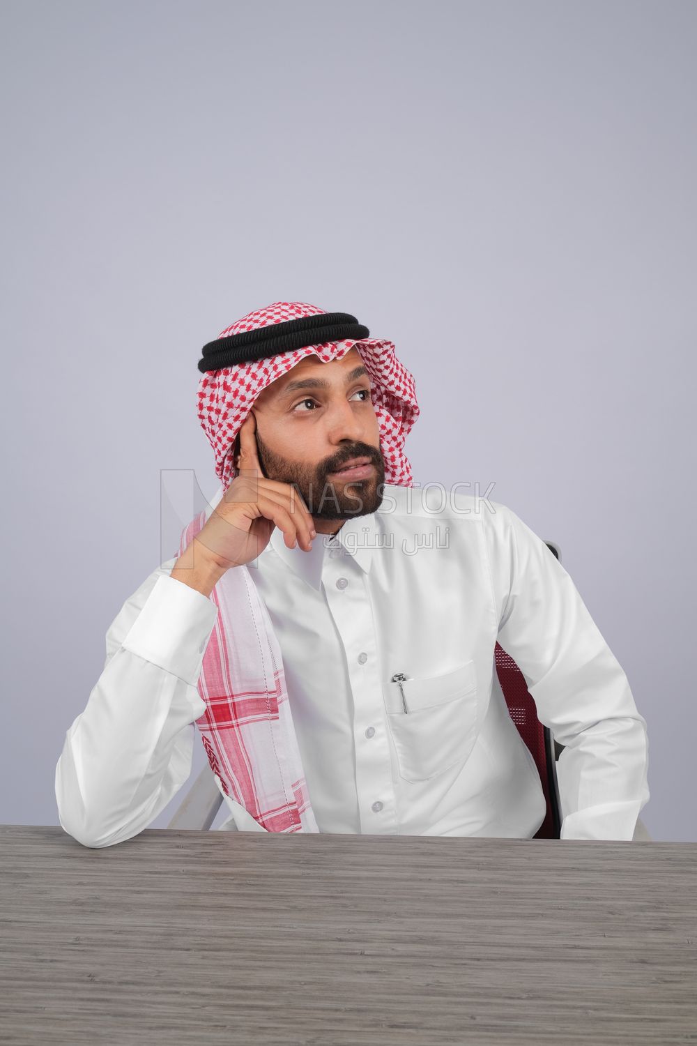 Gulf man sitting at desk