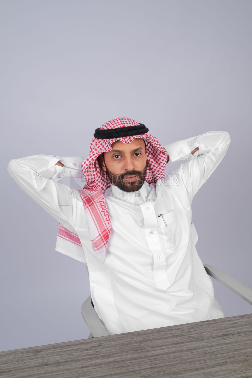 Gulf man sitting at desk