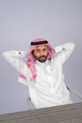 Gulf man sitting at desk