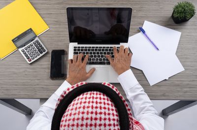 Gulf man working in company