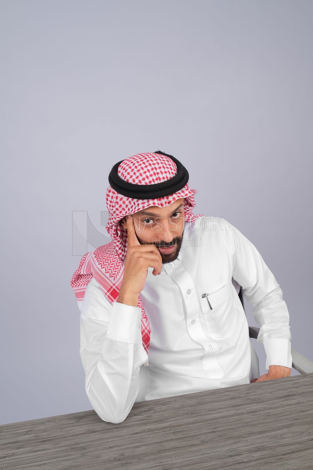 Gulf man sitting at desk