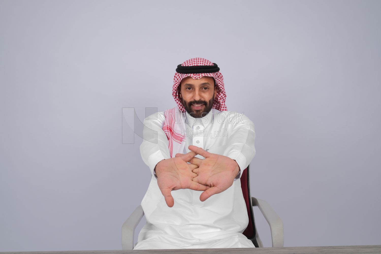 Gulf man sitting at desk