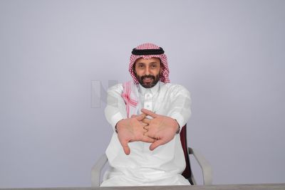 Gulf man sitting at desk