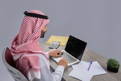 Gulf man working in company