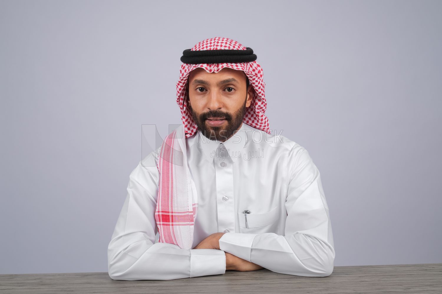 Gulf man sitting at desk