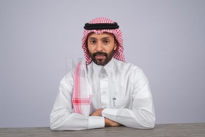 Gulf man sitting at desk