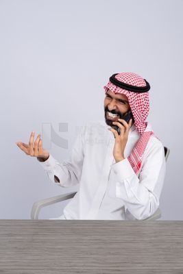 Gulf man talking happily on the phone
