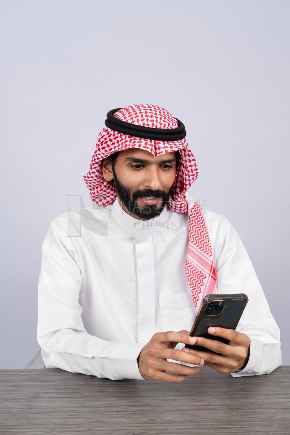 Gulf man using a phone