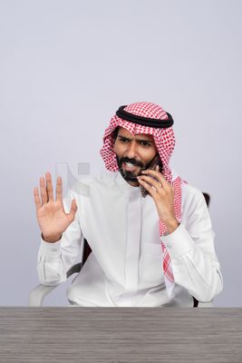Gulf man talking on the phone