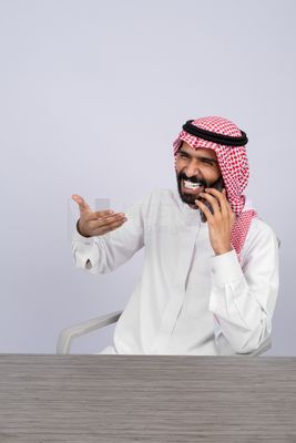 Gulf man talking on the phone happily